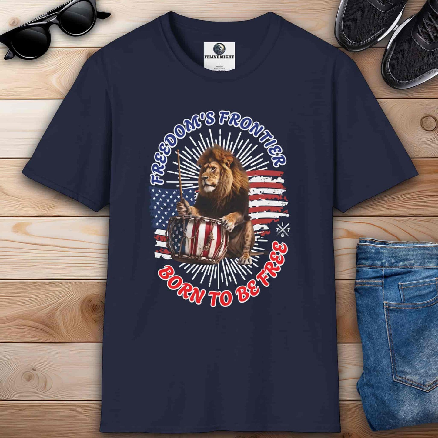 Navy blue T-shirt with the slogan 'Born to Be Free' and a graphic design featuring the American flag and a lion playing the drums.