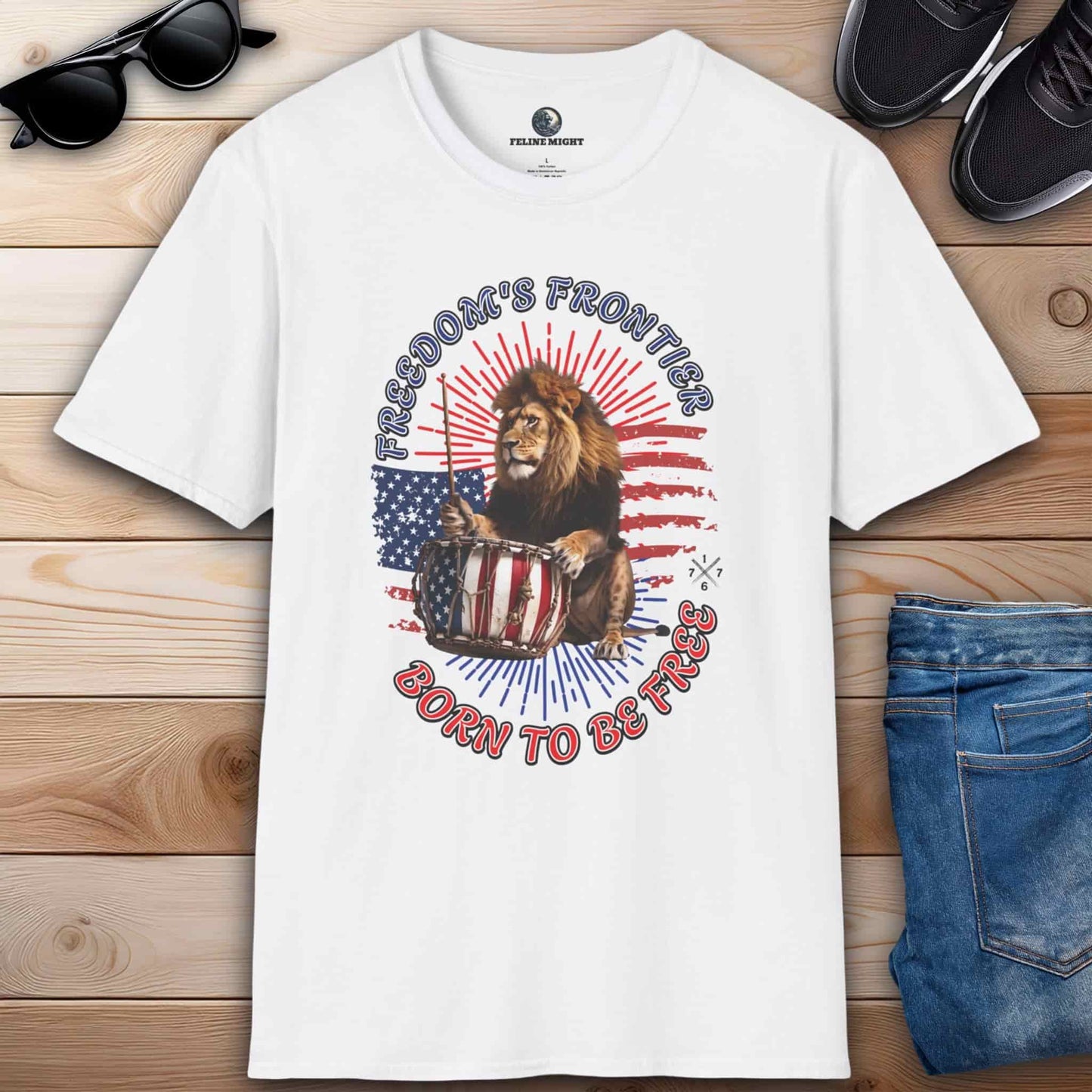 White T-shirt with the slogan 'Born to Be Free' and a graphic design featuring the American flag and a lion playing the drums.
