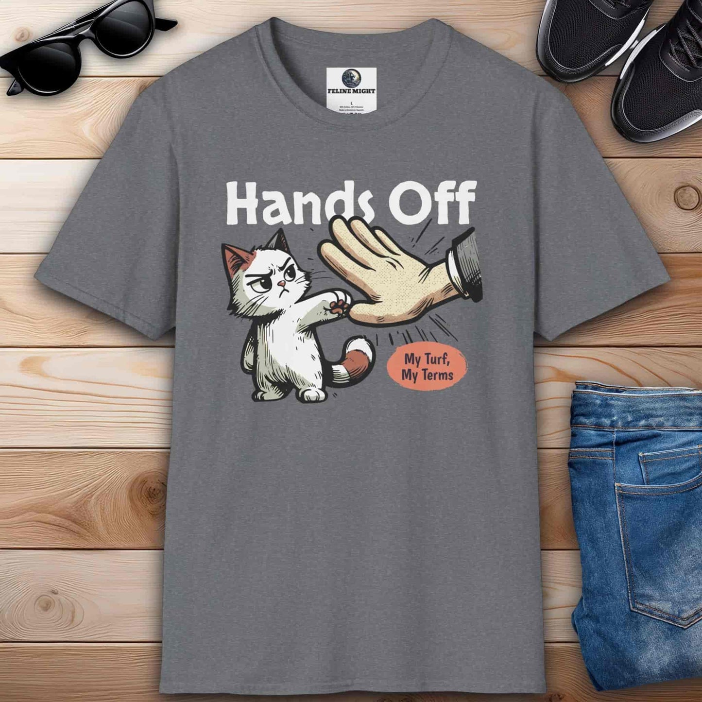 Athletic heather grey graphic t-shirt featuring a cat and the phrase “Hands off, my turf, my terms,” ideal for expressing confidence and humor.