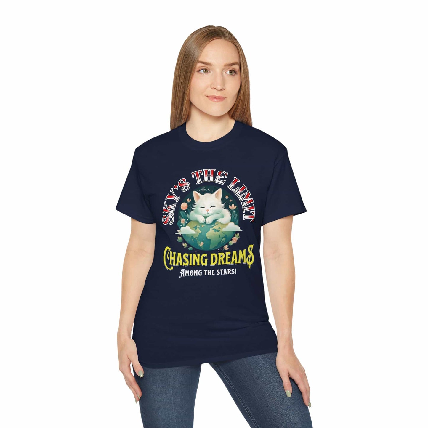 A woman wearing a navy blue Chasing Dreams Cat T-Shirt featuring a cat and motivational text "Sky's the Limit".
