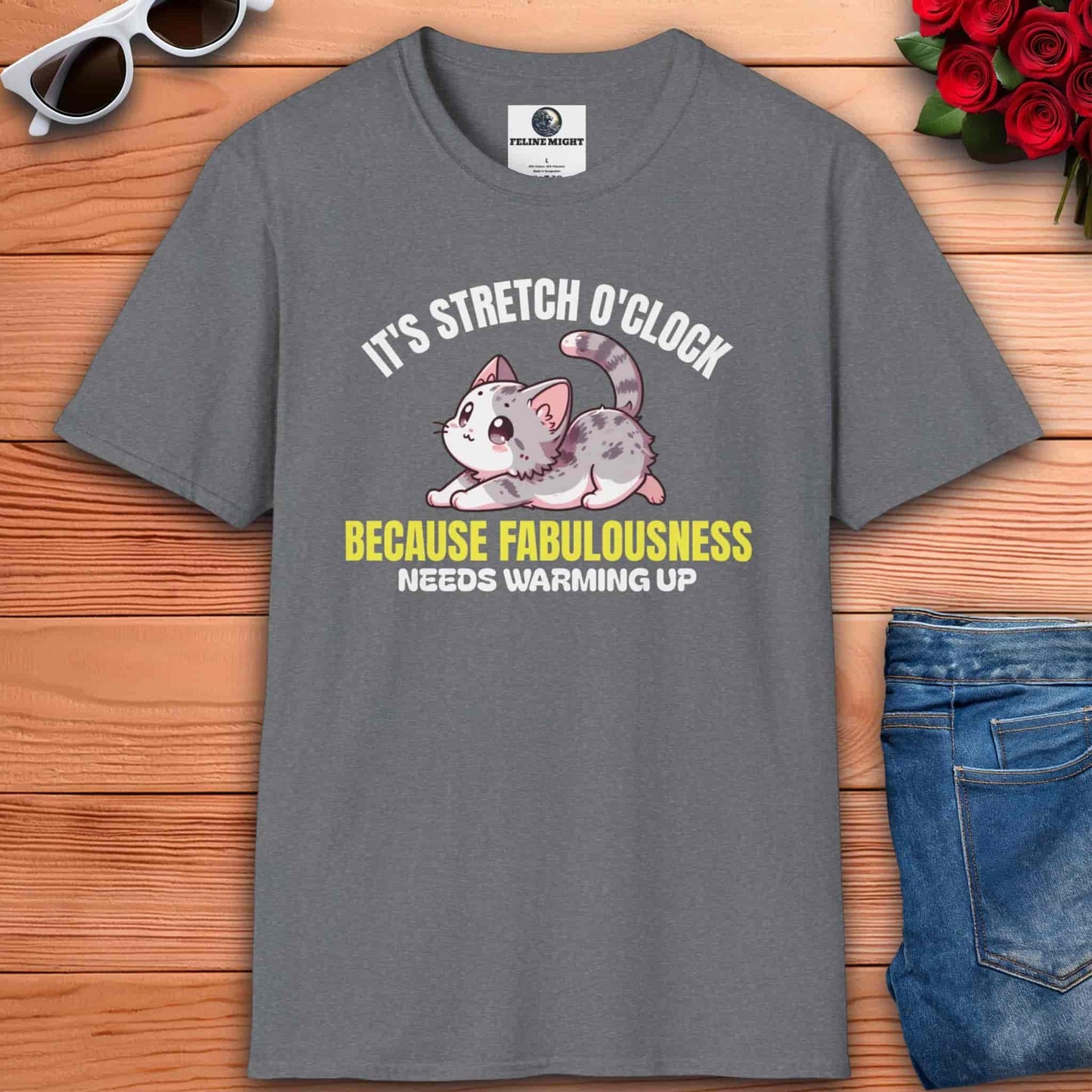 Funny stretching cat lover tee featuring a grey t-shirt with a cute cat design and the text ‘It’s Stretch O’Clock. Because Fabulousness Needs Warming Up’