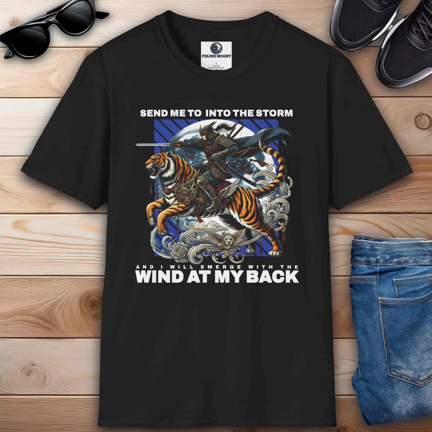 Black t-shirt with a warrior riding a tiger and the phrase "Send me into the storm and I will emerge with the wind at my back", inspired by adventure and courage.