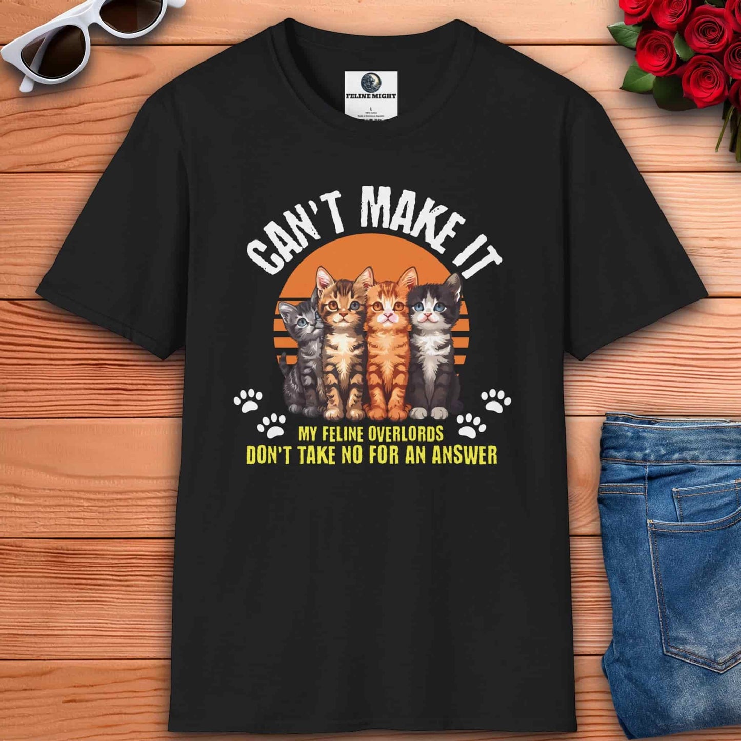 Humorous black t-shirt featuring cats and the phrase 'My Feline Overlords don't take no for an answer', ideal for cat enthusiasts who enjoy playful style in their outfits.