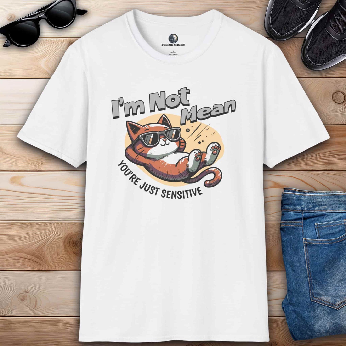 A humorous white t-shirt featuring a laid-back cat wearing sunglasses with the text 'I'm Not Mean, You're Just Sensitive'