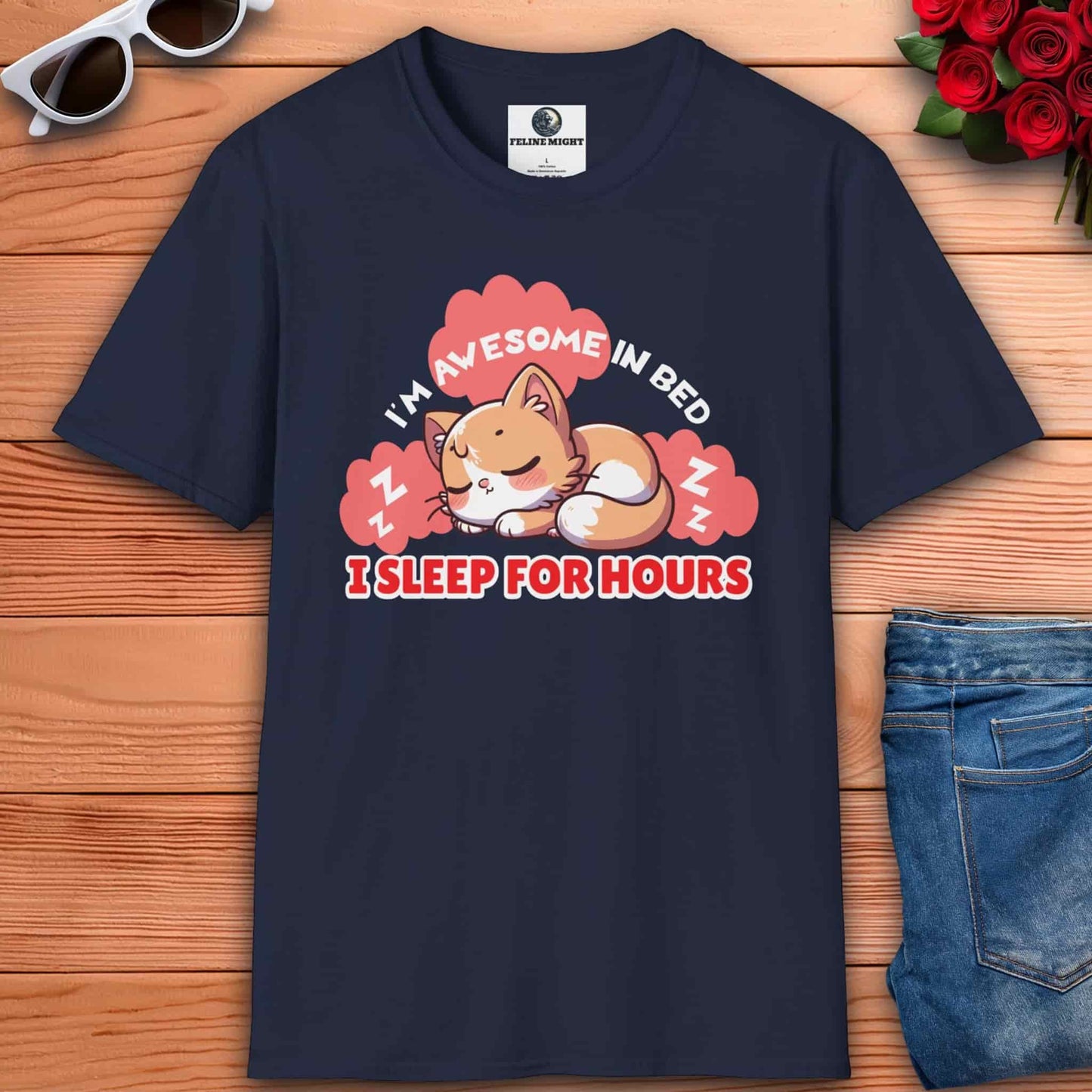 A navy blue t-shirt displaying the text "I'm awesome in bed - I sleep for hours" is perfect for cat lovers.