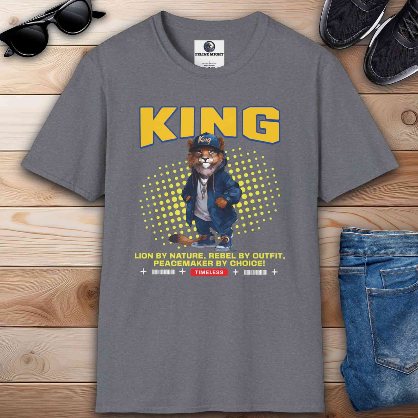 A stylish gray t-shirt featuring a lion character with the word 'KING' and a catchy slogan.