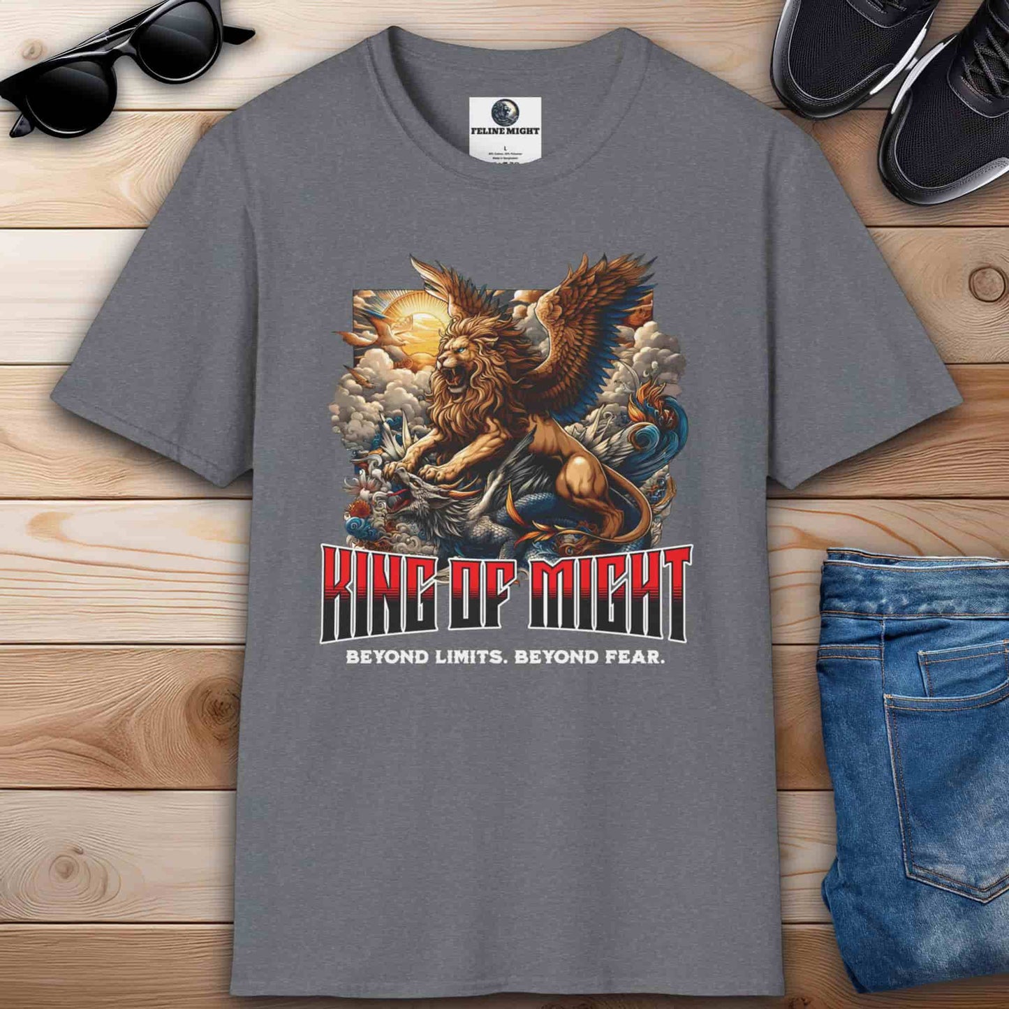 Gray t-shirt featuring a winged lion and dragon design with the text 'King of Might' and 'Beyond Limits. Beyond Fear.'