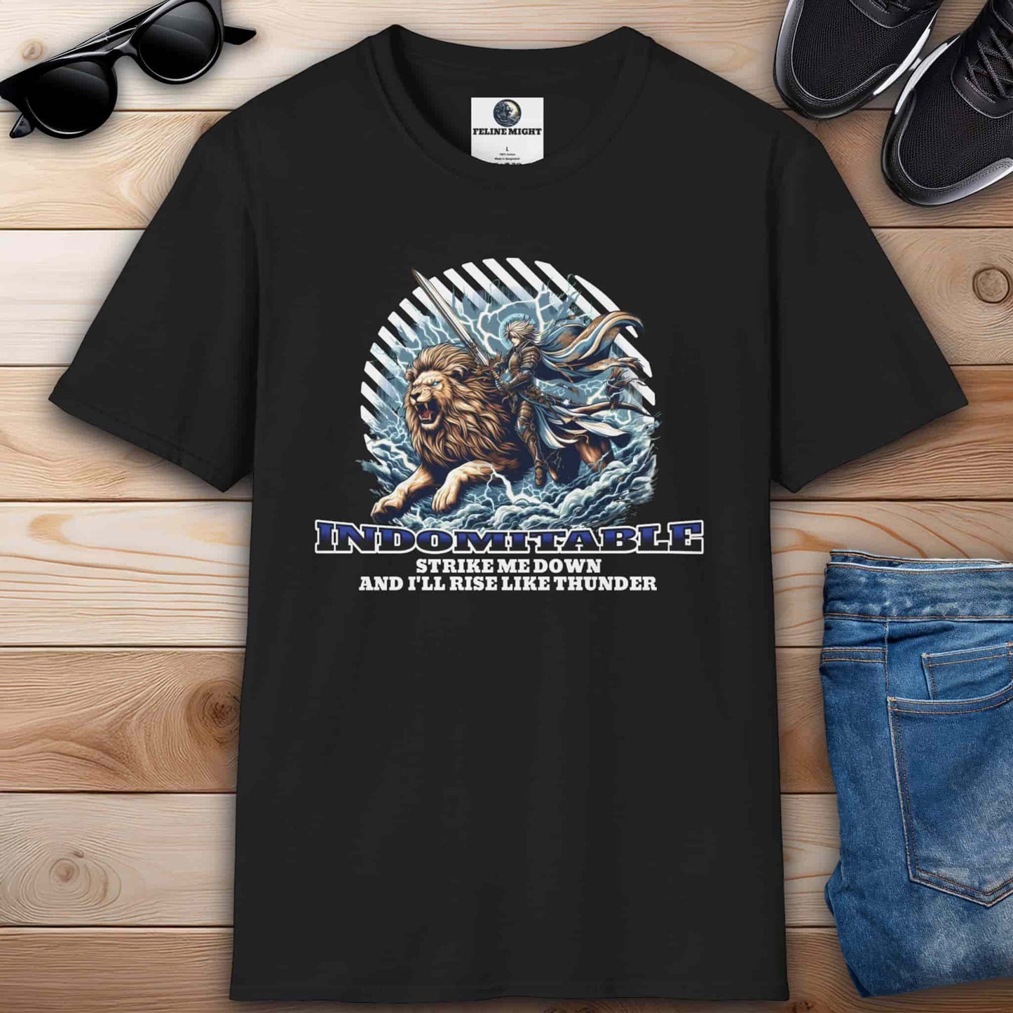 Black t-shirt featuring an indomitable lion and warrior graphic with the quote 'Strike me down and I'll rise like thunder.'