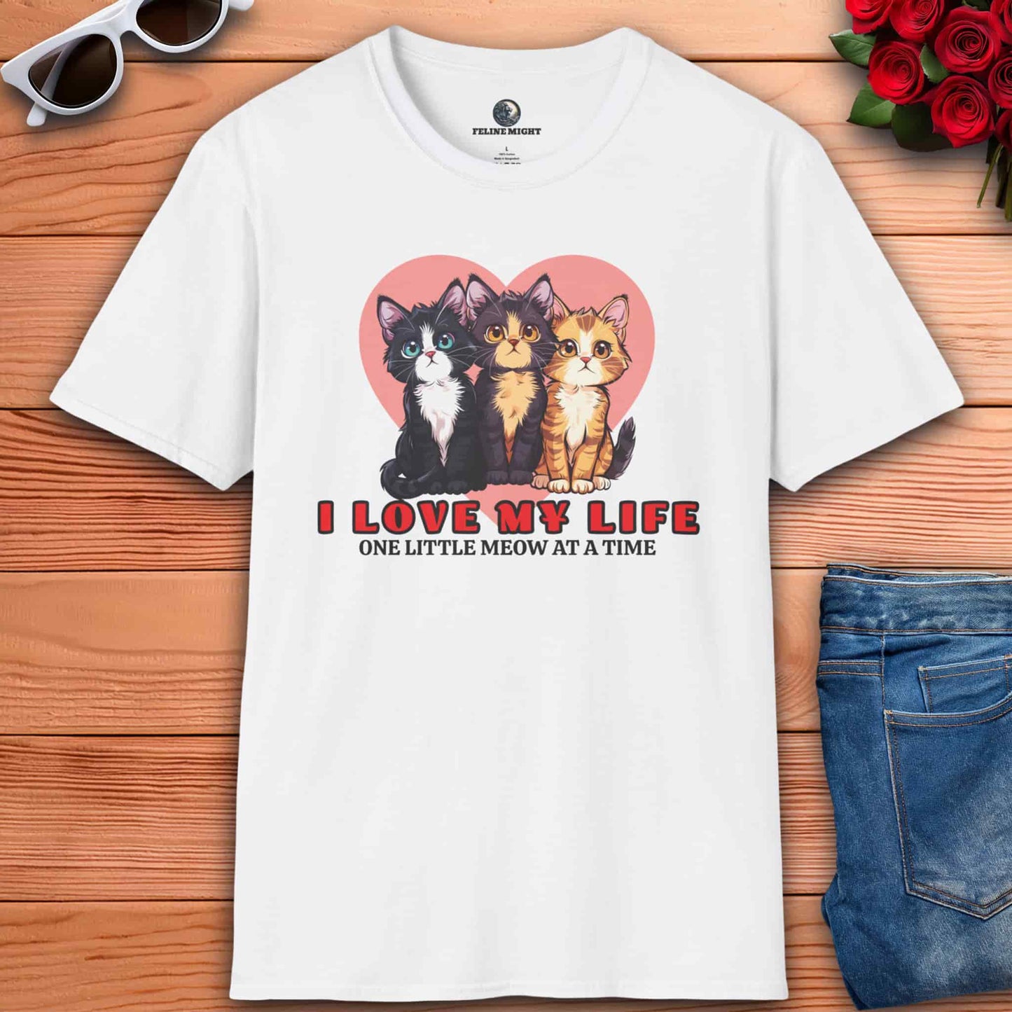 White t-shirt featuring three cute cats and the phrase 'I Love My Life, One Little Meow at a Time' with a heart background.