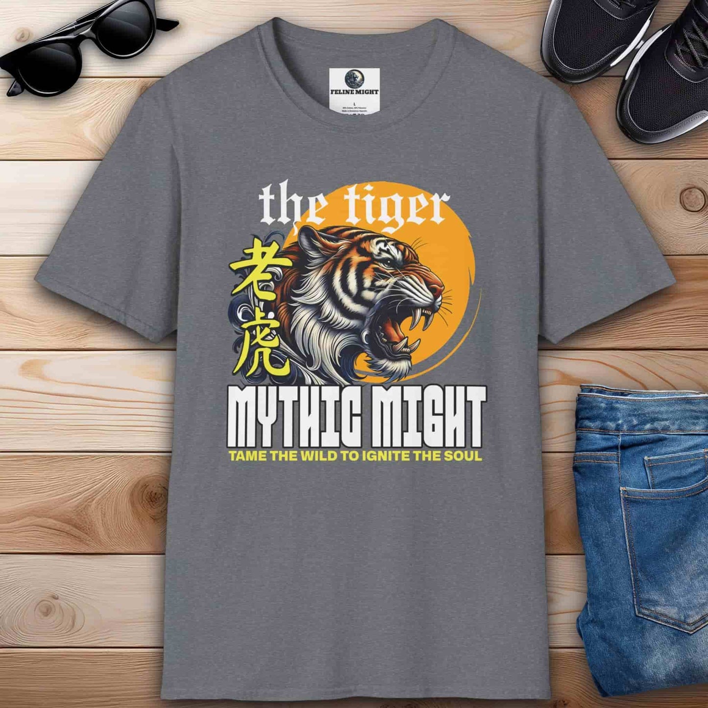 Gray t-shirt featuring a fierce tiger design with the text 'Mythic Might' and 'Tame the Wild to Ignite the Soul'.