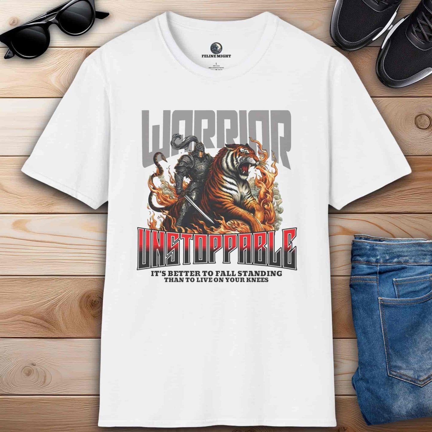White t-shirt featuring a warrior and tiger graphic with the text 'Unstoppable' and a motivational quote.
