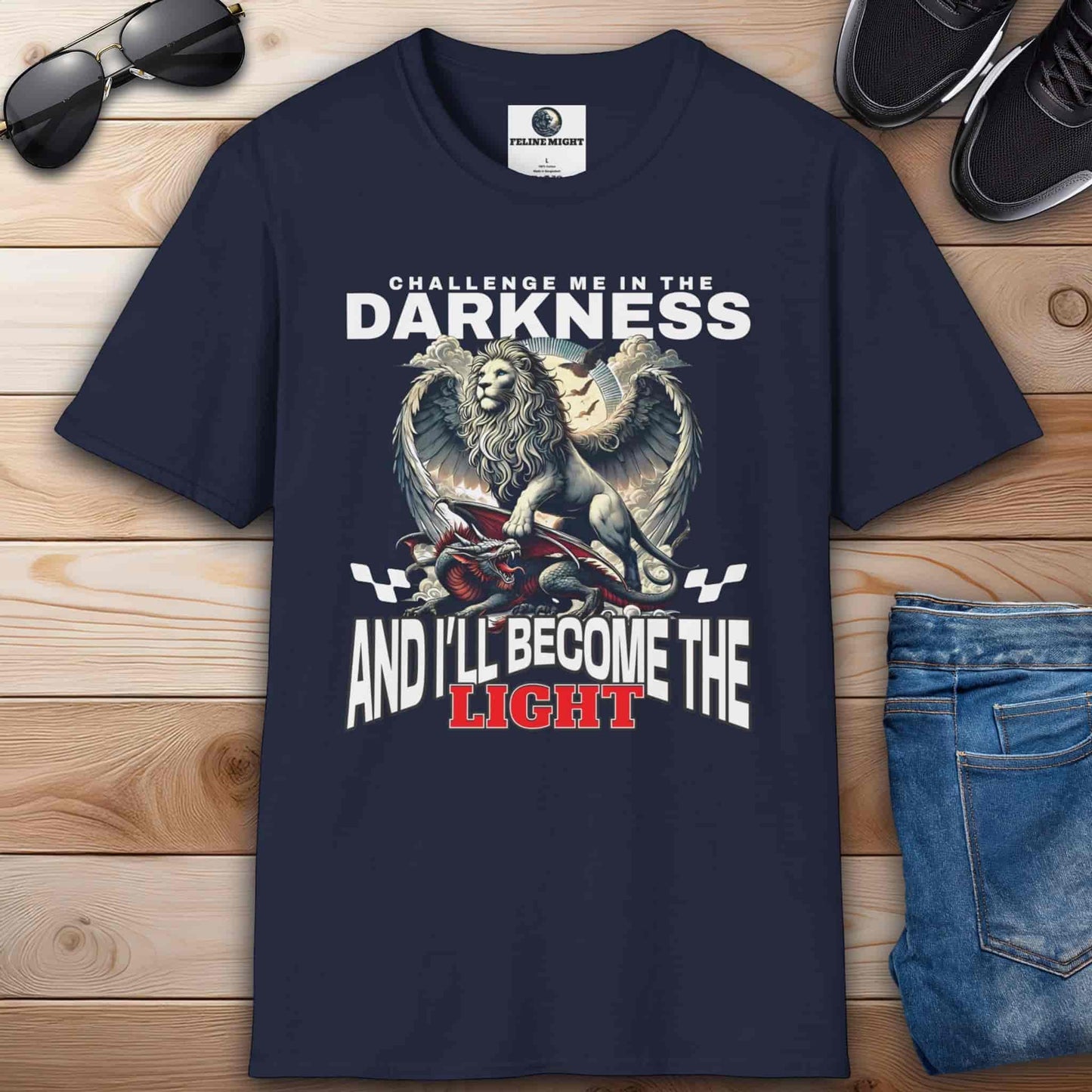 A navy blue Challenge Me in the Darkness Lion T-Shirt featuring a majestic winged lion graphic.