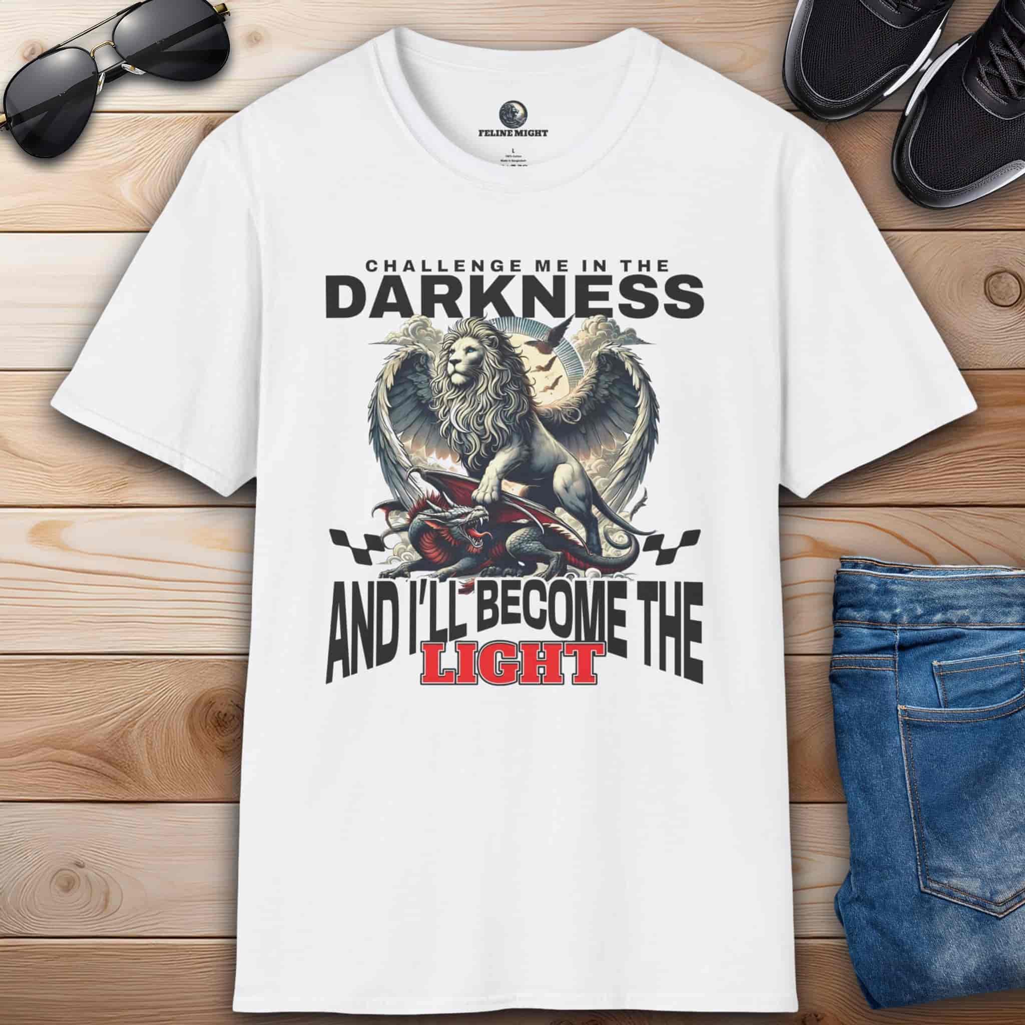A White "Challenge Me" Lion T-Shirt featuring a majestic winged lion graphic and the text "Challenge me in the Darkness and I'll Become the Light".