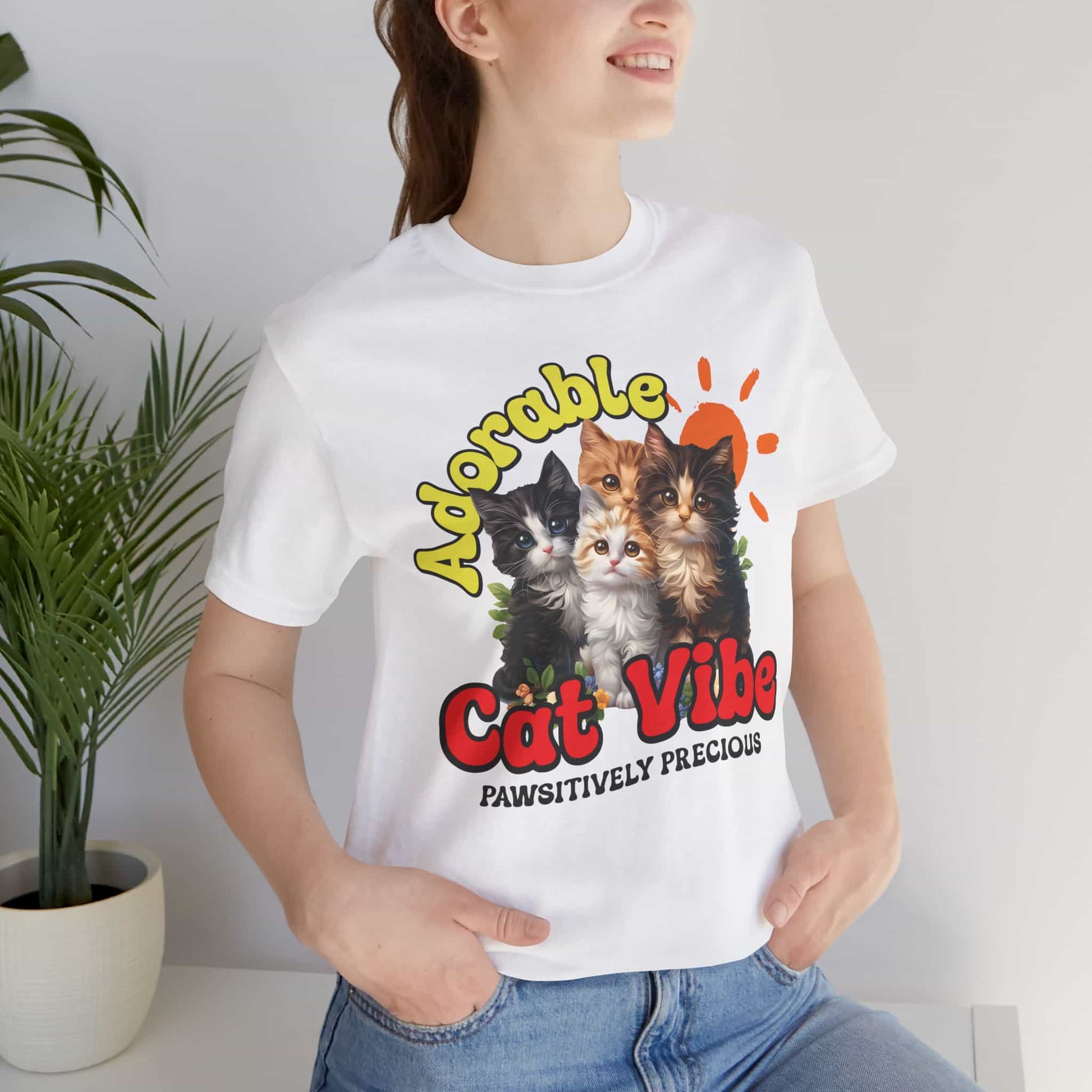 A close-up of a woman wearing a white Adorable Cat Vibe T-Shirt featuring four cute cats, perfect for cat lovers who embrace their feline passion.