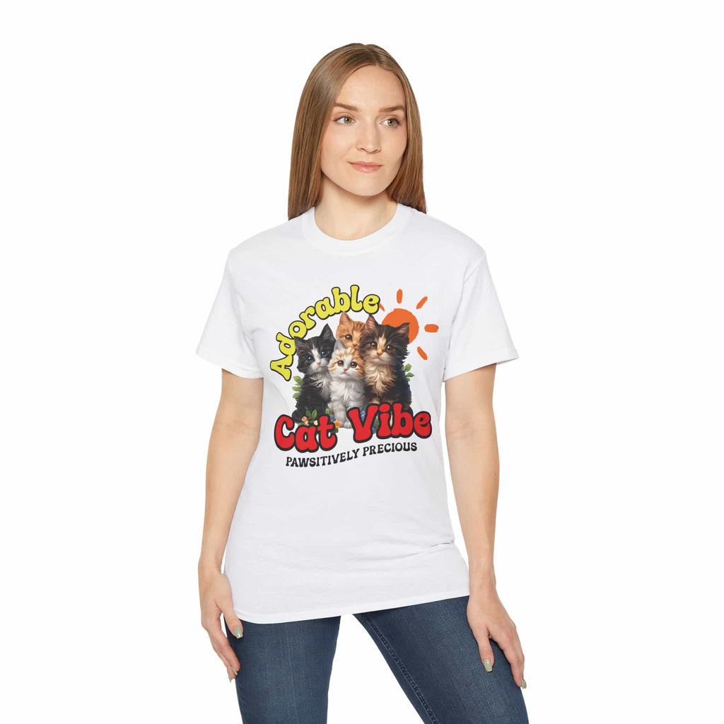 A woman wearing a white Adorable Cat Vibe Graphic T-Shirt featuring four cats, perfect for cat lovers who embrace their feline passion.