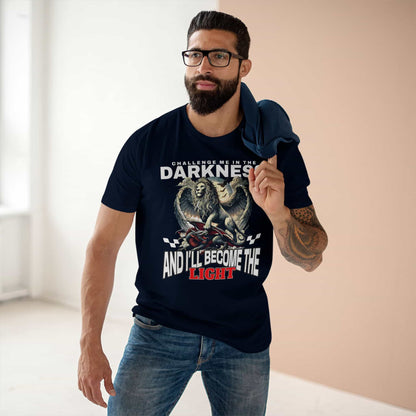 A man wearing a navy blue Challenge Me in the Darkness Lion T-Shirt featuring a majestic winged lion graphic.