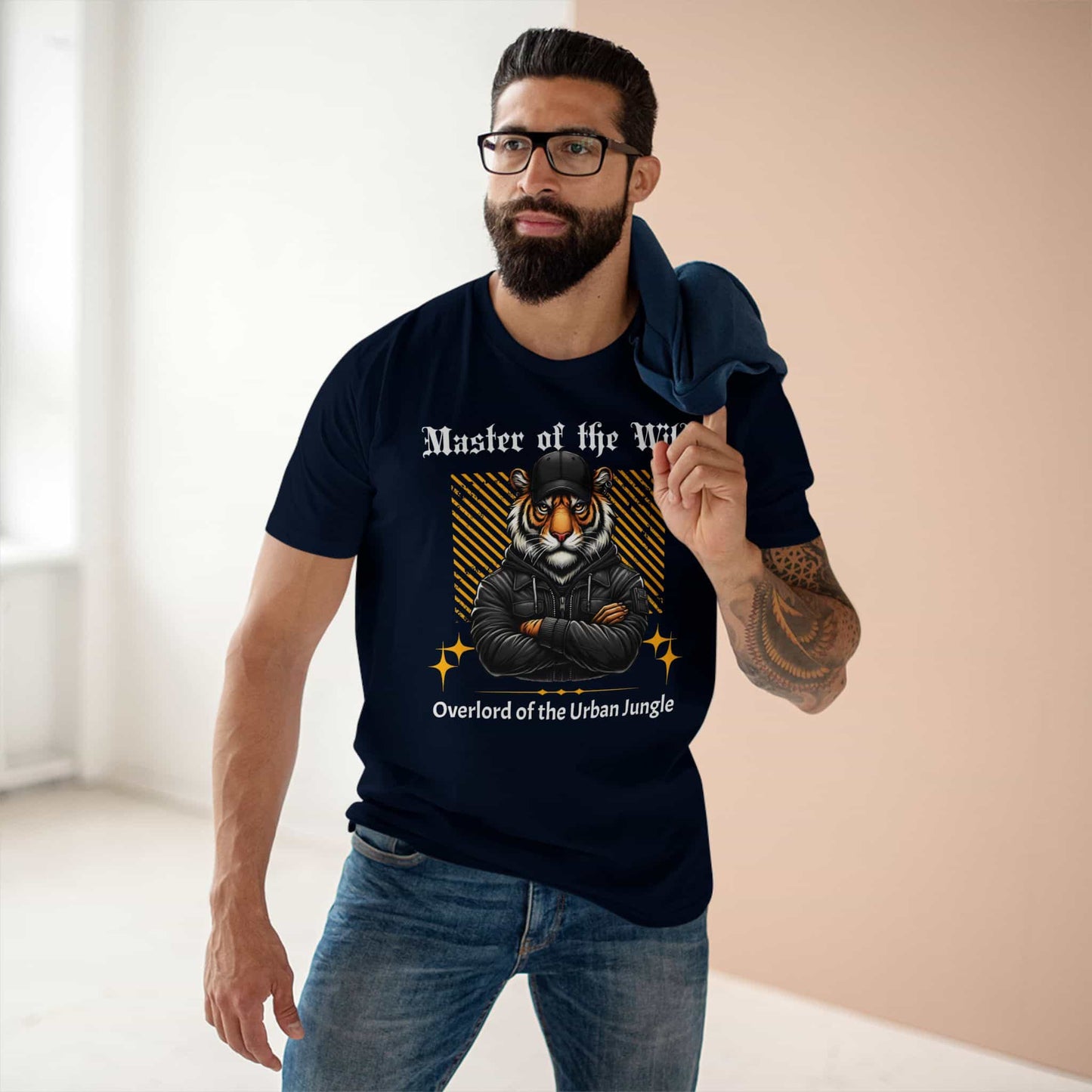 A man wearing navy blue Master of the Wild Tiger T-Shirt featuring a bold tiger graphic and the text 'Overlord of the Urban Jungle'.