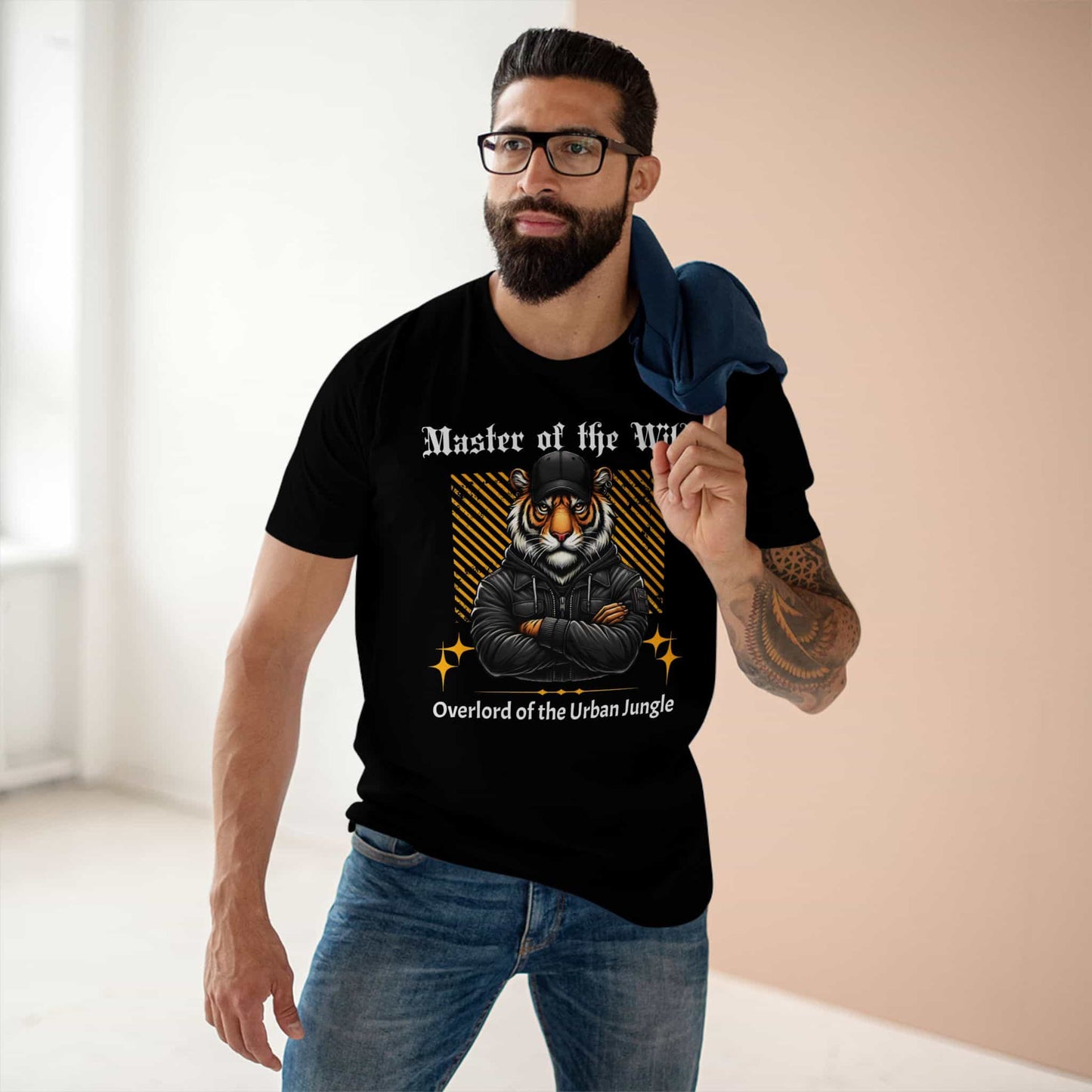 A man wearing black Master of the Wild Tiger T-Shirt featuring a bold tiger graphic and the text 'Overlord of the Urban Jungle'.