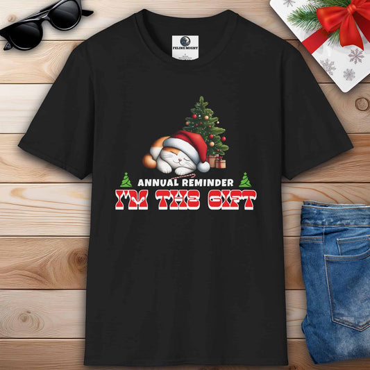 Black t-shirt with a Christmas cat design and the text 'Annual Reminder I'm the Gift'