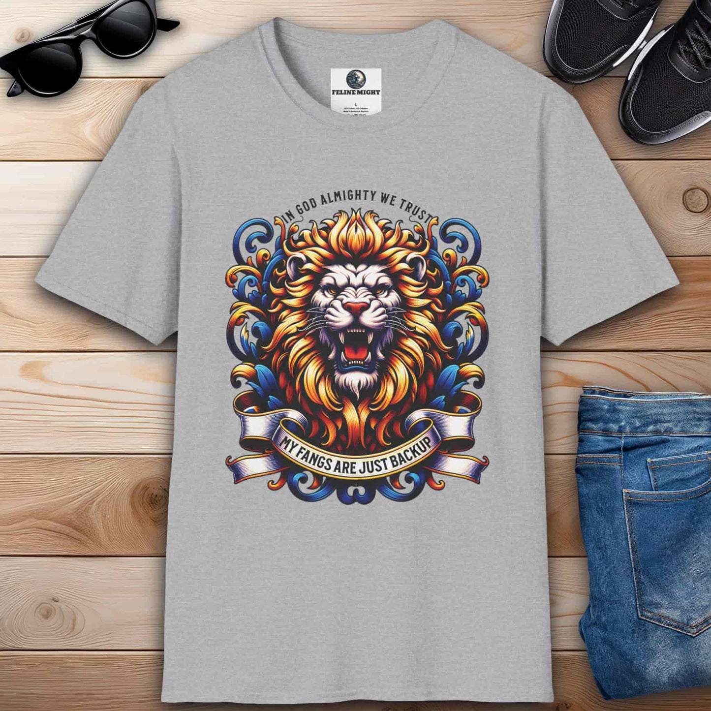 Grey graphic t-shirt with a colorful lion design and the phrase 'In God Almighty We Trust'.