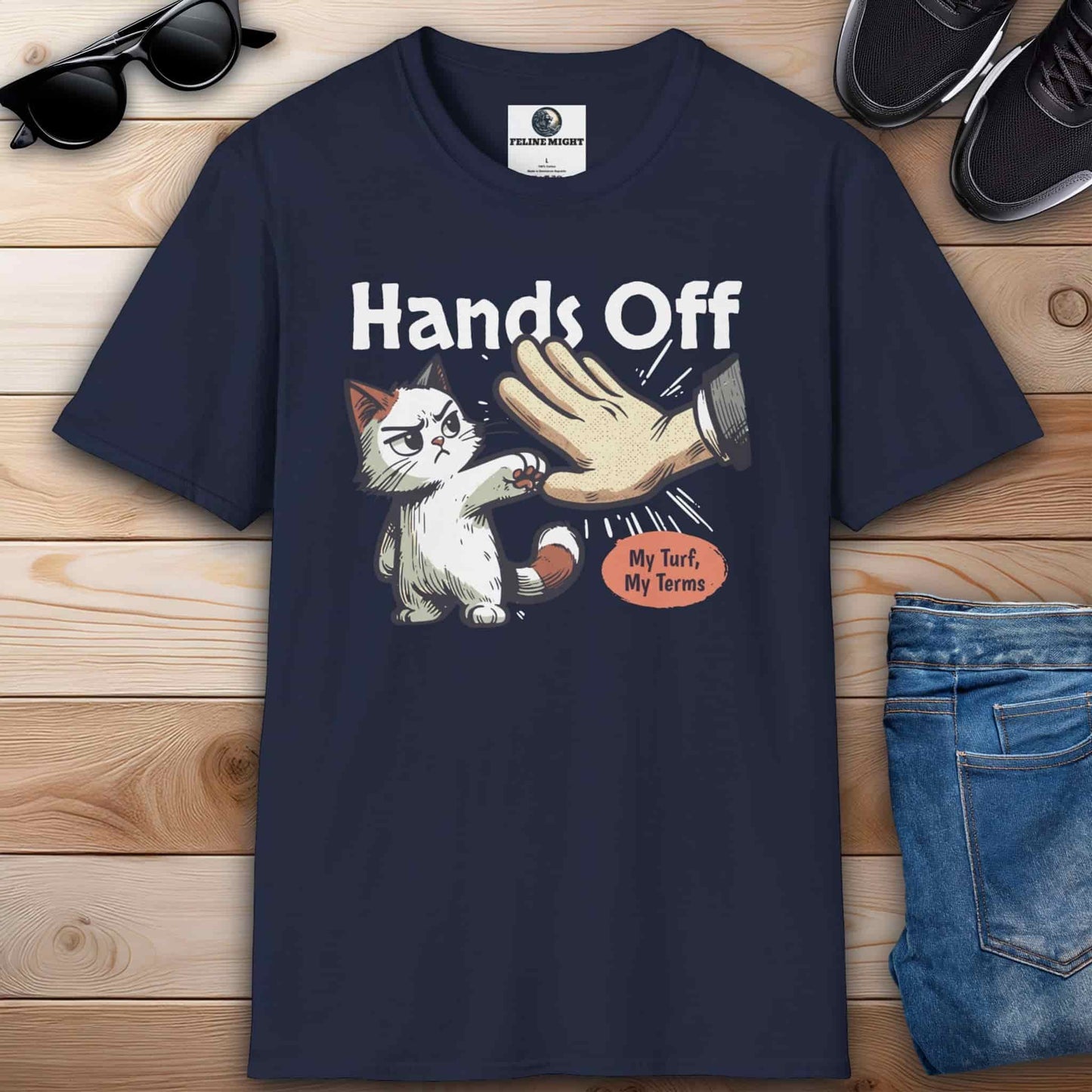 Navy blue graphic t-shirt featuring a cat and the phrase “Hands off, my turf, my terms,” ideal for expressing confidence and humor.