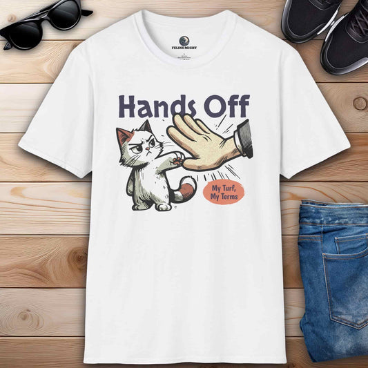 White graphic t-shirt featuring a cat and the phrase “Hands off, my turf, my terms,” ideal for expressing confidence and humor.