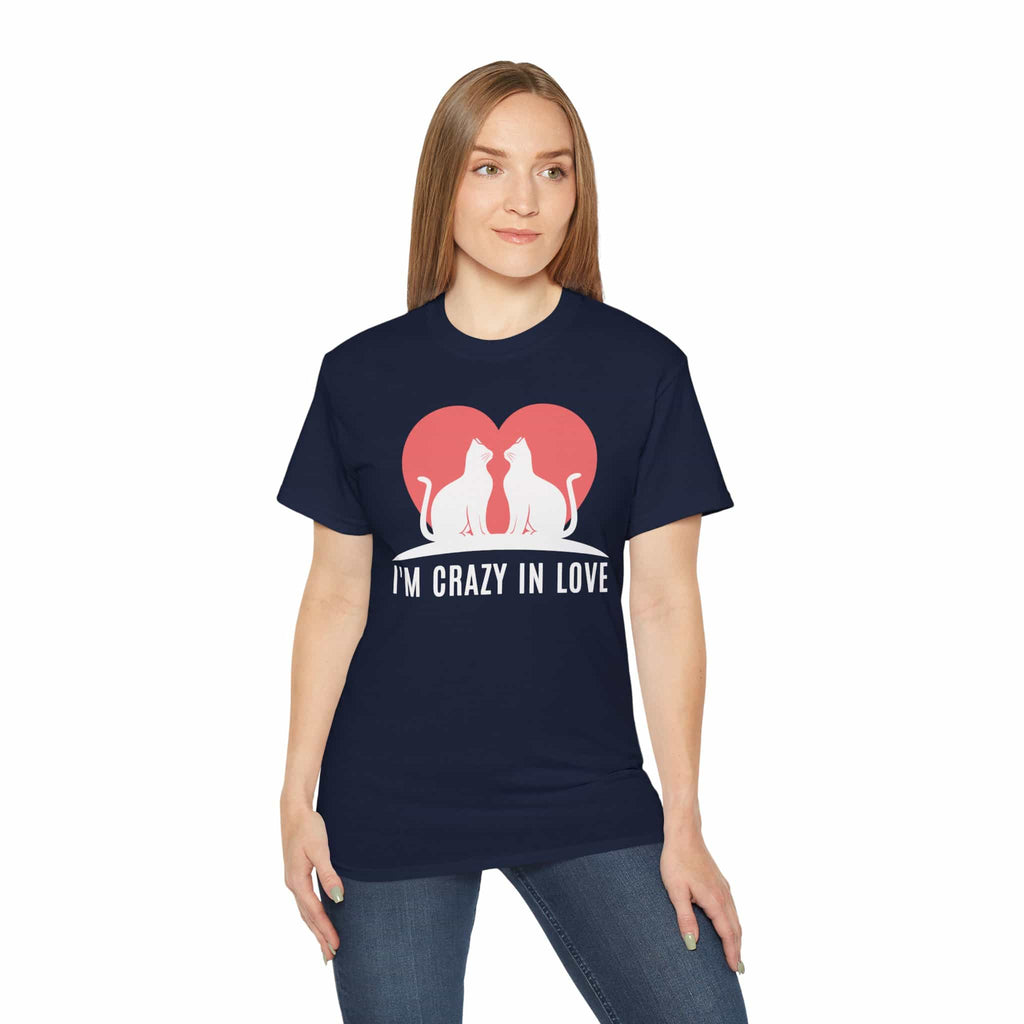 A woman wearing a navy blue I'm Crazy in Love Cat T-Shirt featuring two cats with a heart design, perfect for romantic cat lovers.