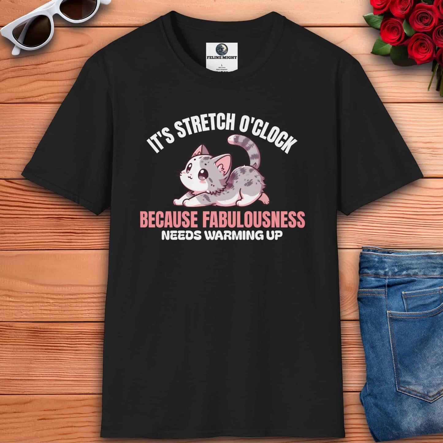 Black t-shirt with a cute cat design and the text 'It's Stretch O'Clock. Because Fabulousness Needs Warming Up'