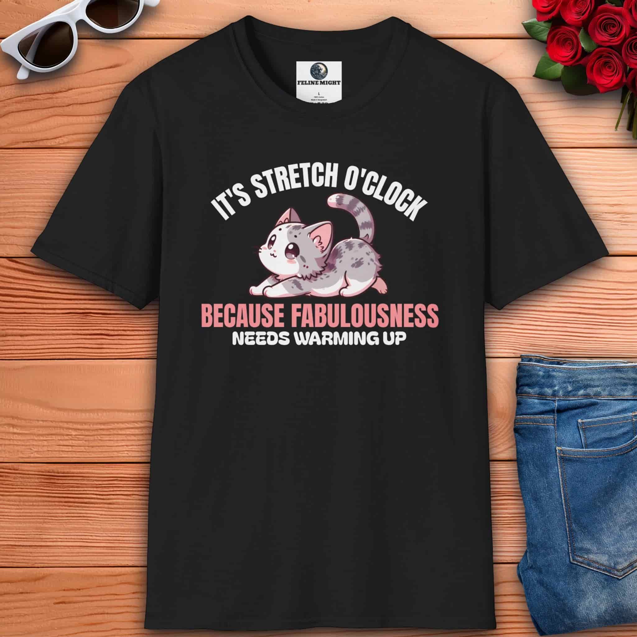 Funny stretching cat lover tee featuring a black t-shirt with a cute cat design and the text ‘It’s Stretch O’Clock. Because Fabulousness Needs Warming Up’