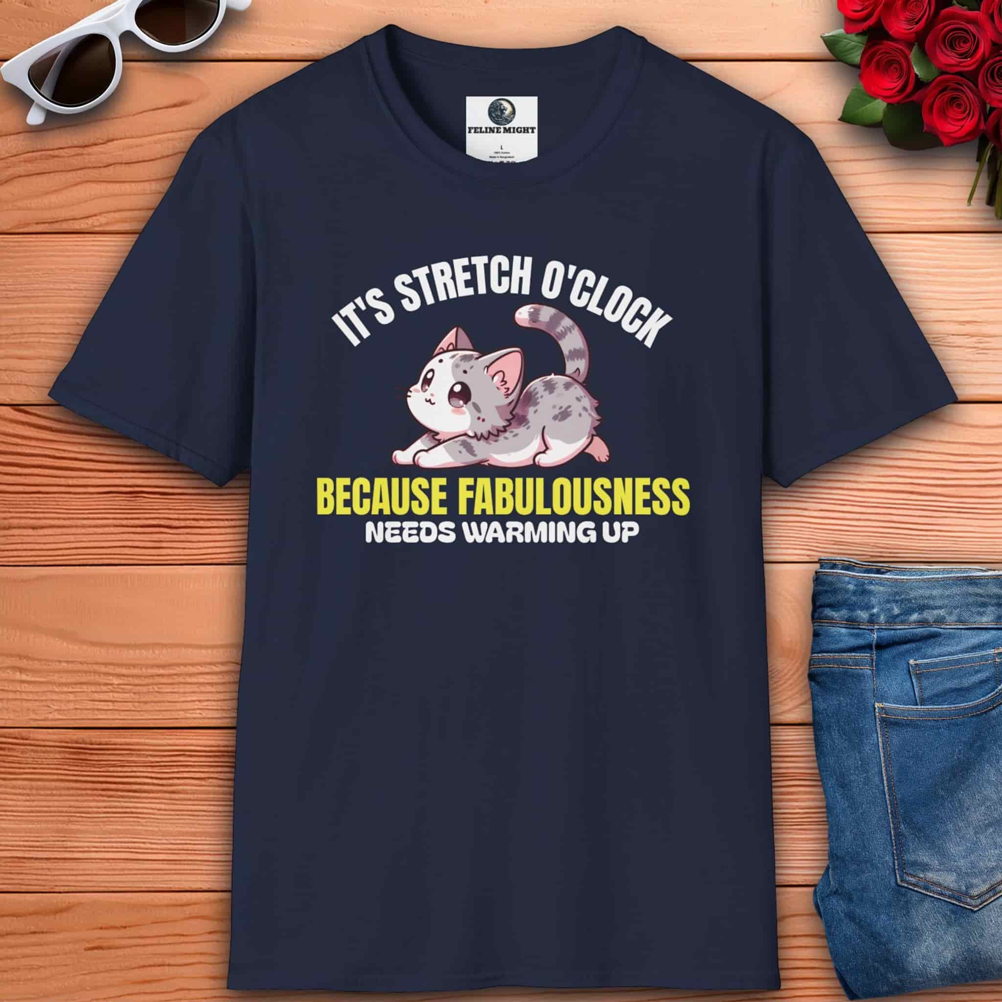 Funny stretching cat lover tee featuring a navy blue t-shirt with a cute cat design and the text ‘It’s Stretch O’Clock. Because Fabulousness Needs Warming Up’