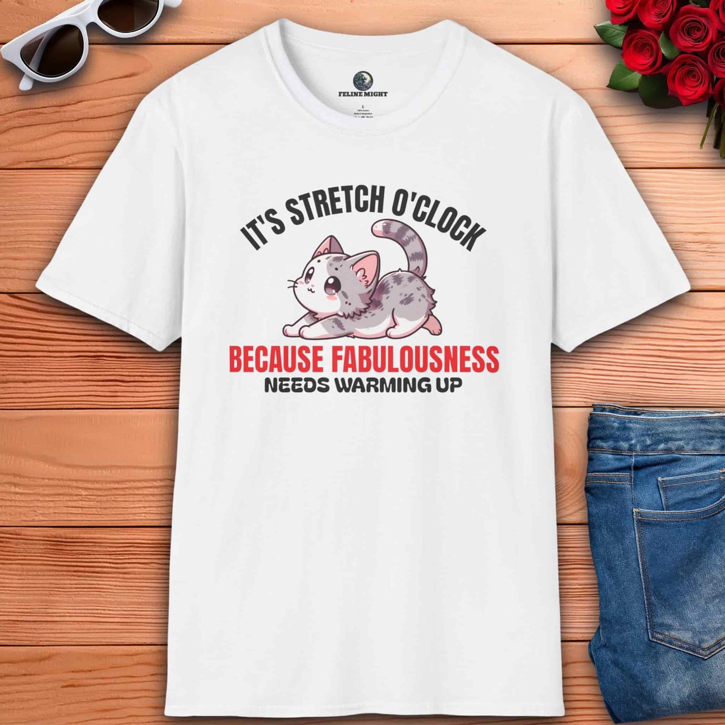 White t-shirt with a cute cat design and the text 'It's Stretch O'Clock. Because Fabulousness Needs Warming Up'