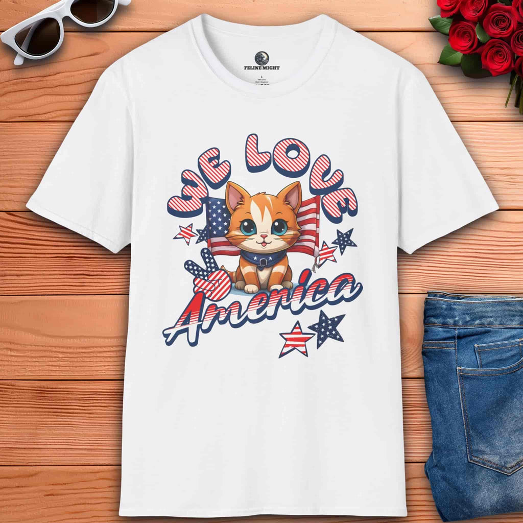 A white We Love America T-Shirt featuring a cat with stars and stripes, showing love for America.
