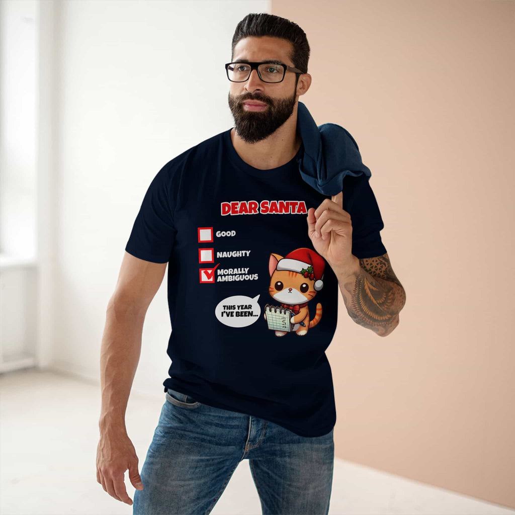 A man wearing a navy blue Dear Santa Cat T-Shirt featuring a cute cat illustration and festive humor.
