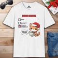 A white Dear Santa Cat T-Shirt featuring a festive cat with a humorous checkbox design for the holiday season.