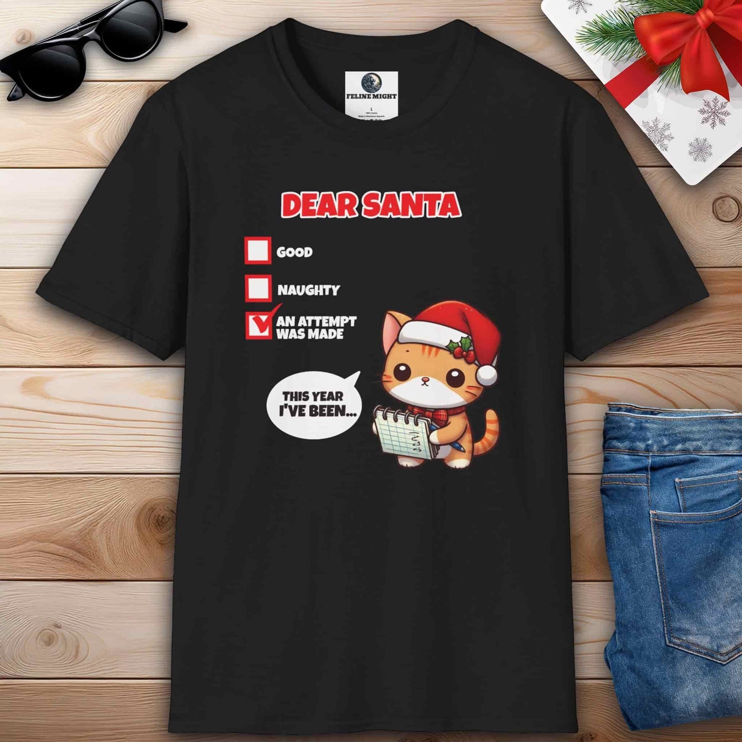 A humorous black t-shirt showcasing a cat wearing a Santa hat, accompanied by the phrase Dear Santa, perfect for cat lovers.