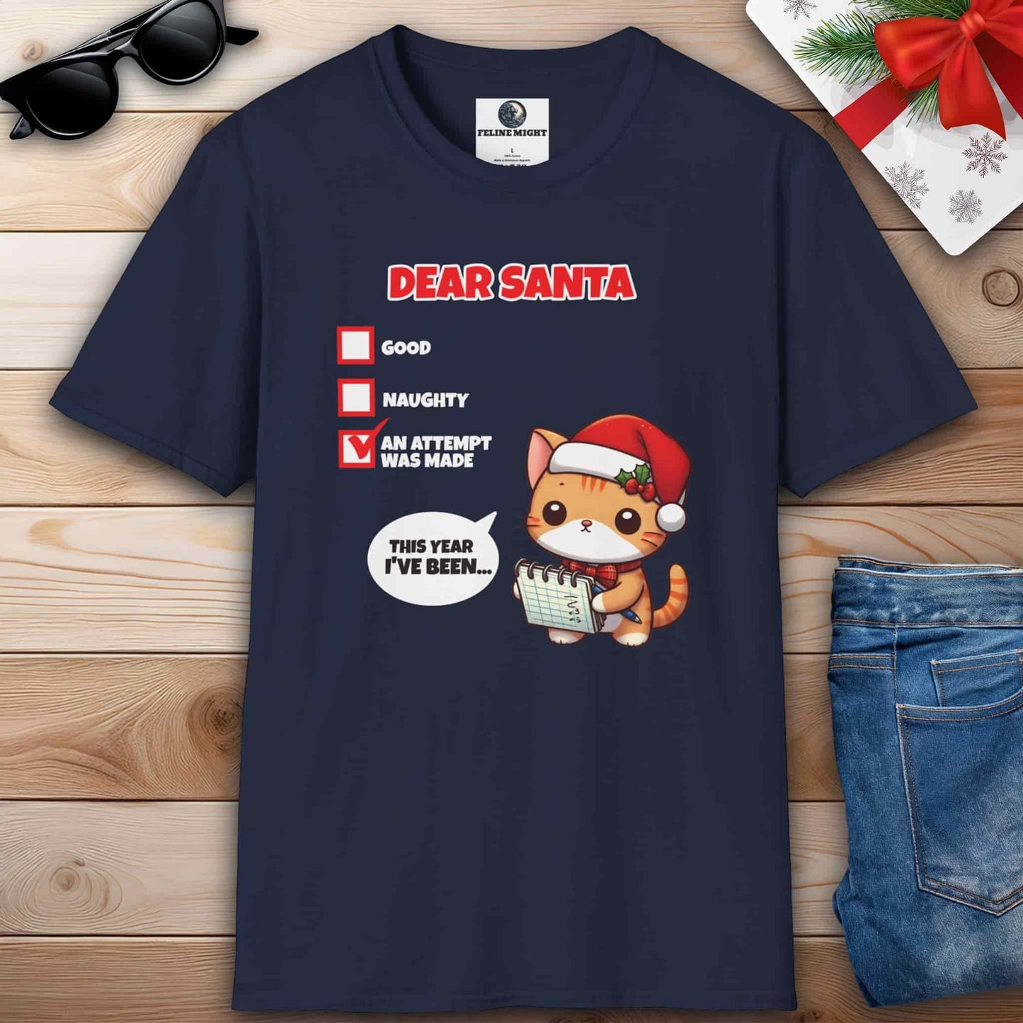 A humorous navy blue t-shirt showcasing a cat wearing a Santa hat, accompanied by the phrase Dear Santa, perfect for cat lovers.