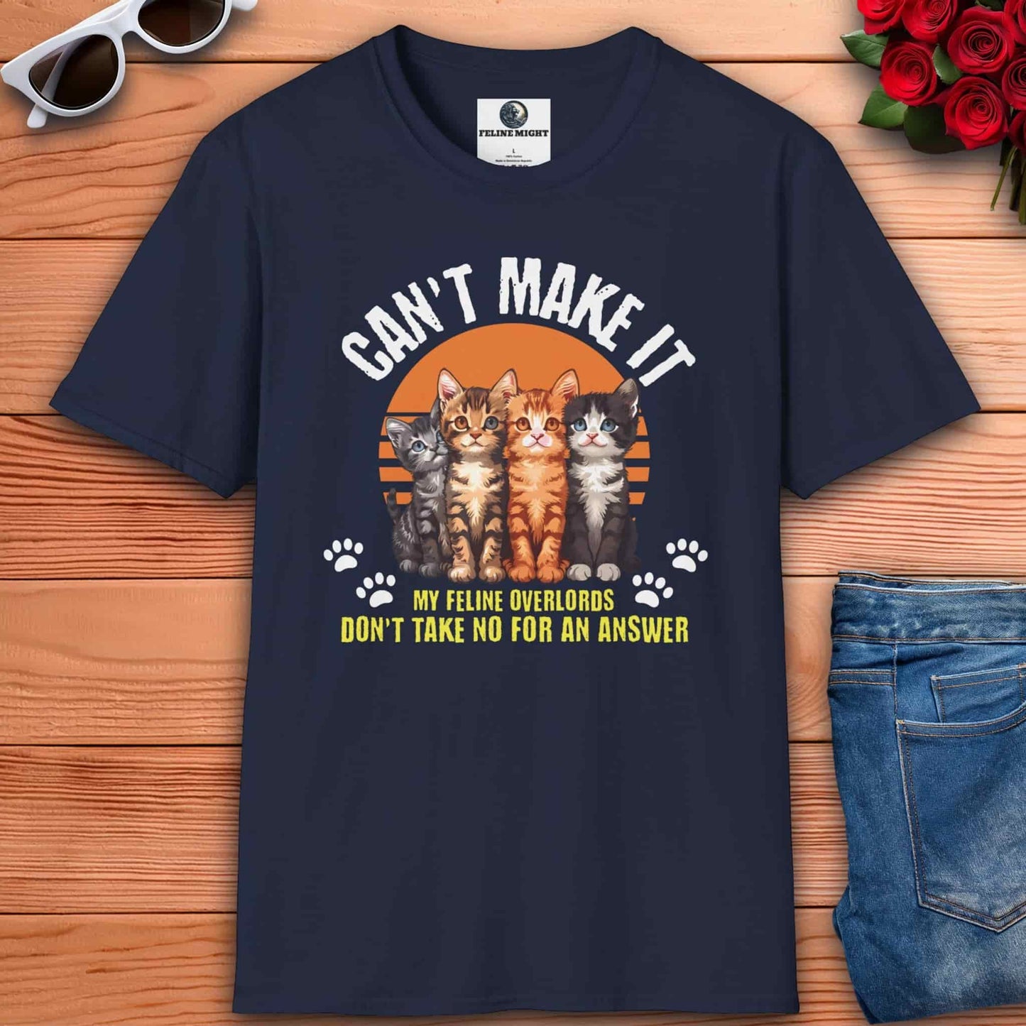 Humorous navy blue t-shirt featuring cats and the phrase 'My Feline Overlords don't take no for an answer', ideal for cat enthusiasts who enjoy playful style in their outfits. 