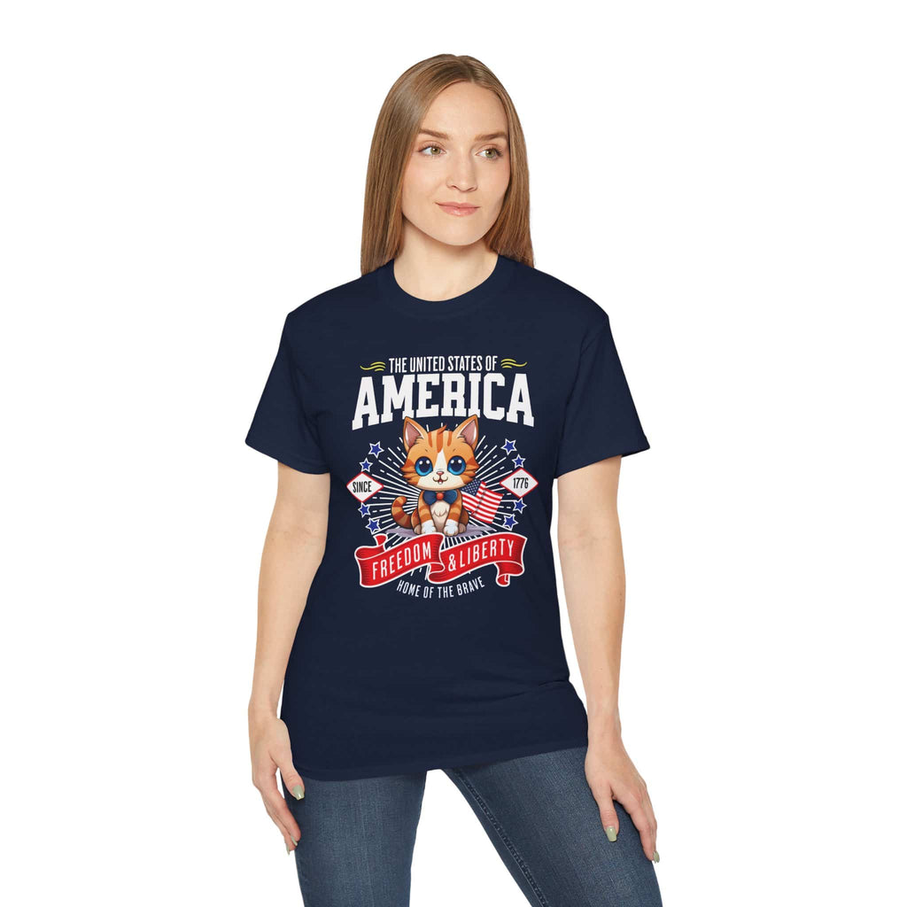 A woman in a navy blue Pawtriotic America T-Shirt featuring a cute kitten with American flag elements, perfect for patriotic cat lovers.