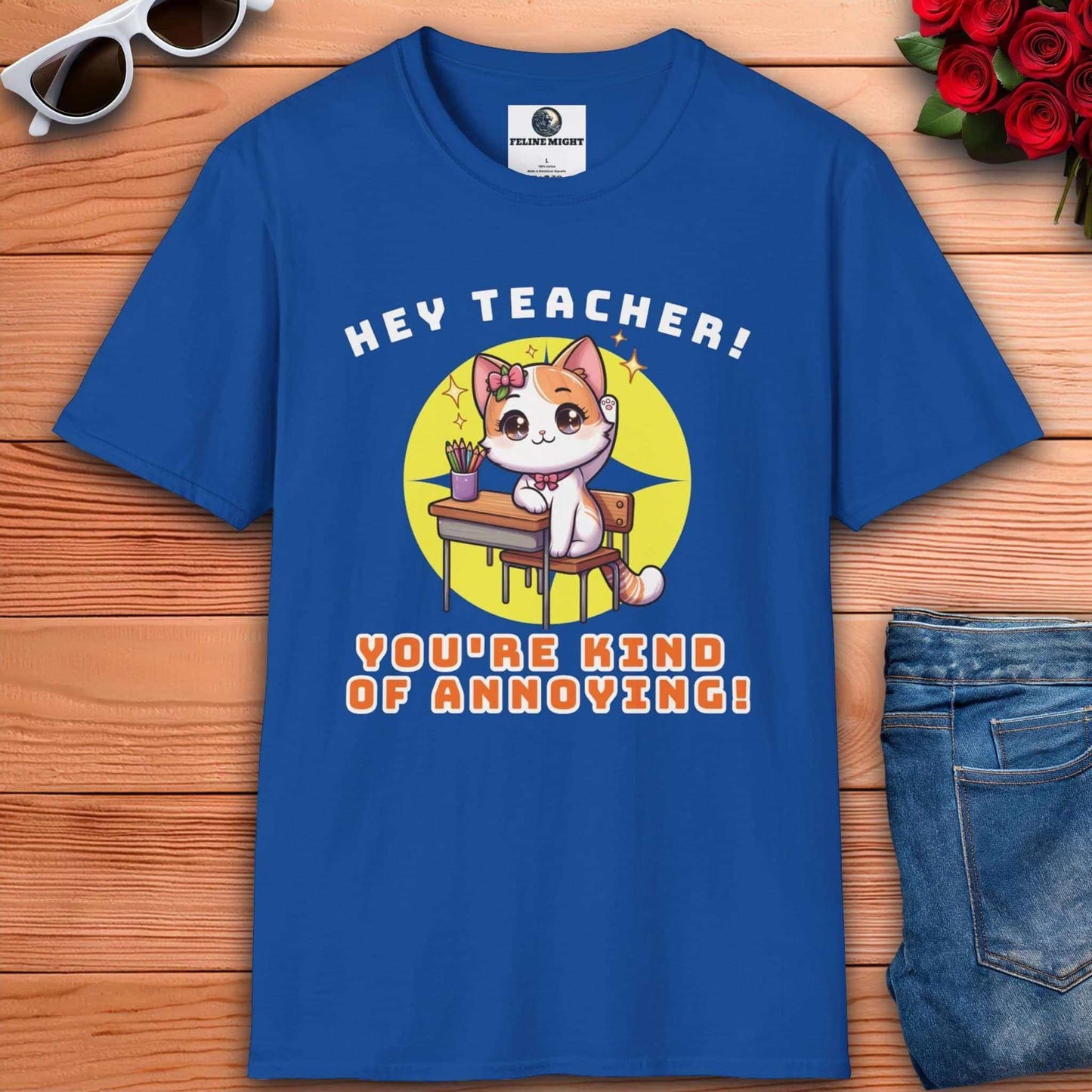 A cute cat character on a royal blue t-shirt saying 'Hey Teacher! You're Kind of Annoying!'