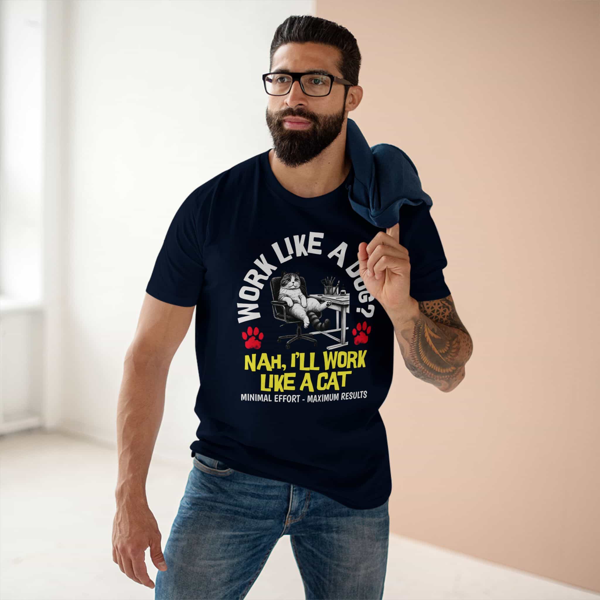 A man in a navy blue Funny Work Cat T-Shirt with a humorous cat graphic and the text 'Work like a dog? Nah, I'll work like a cat.'