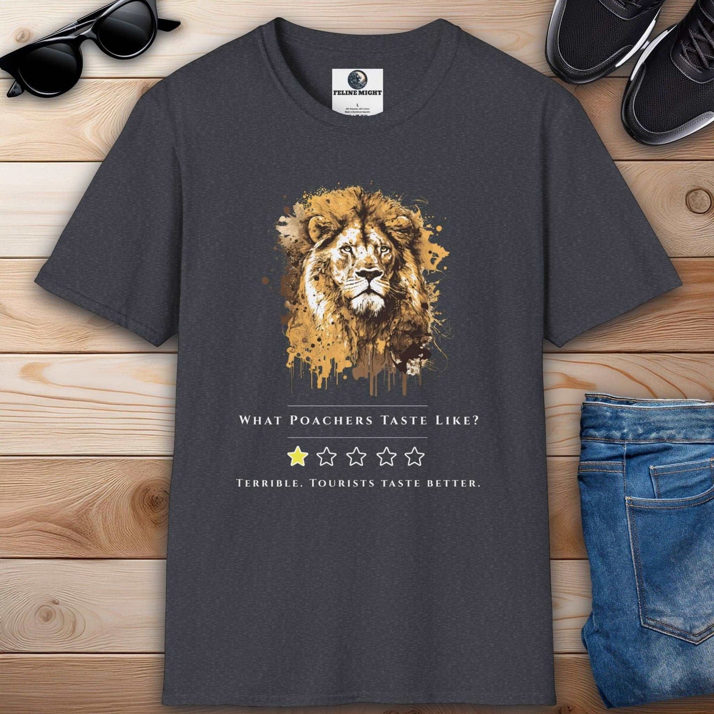 A stylish dark heather grey t-shirt with a lion illustration and the text 'What Poachers Taste Like?'