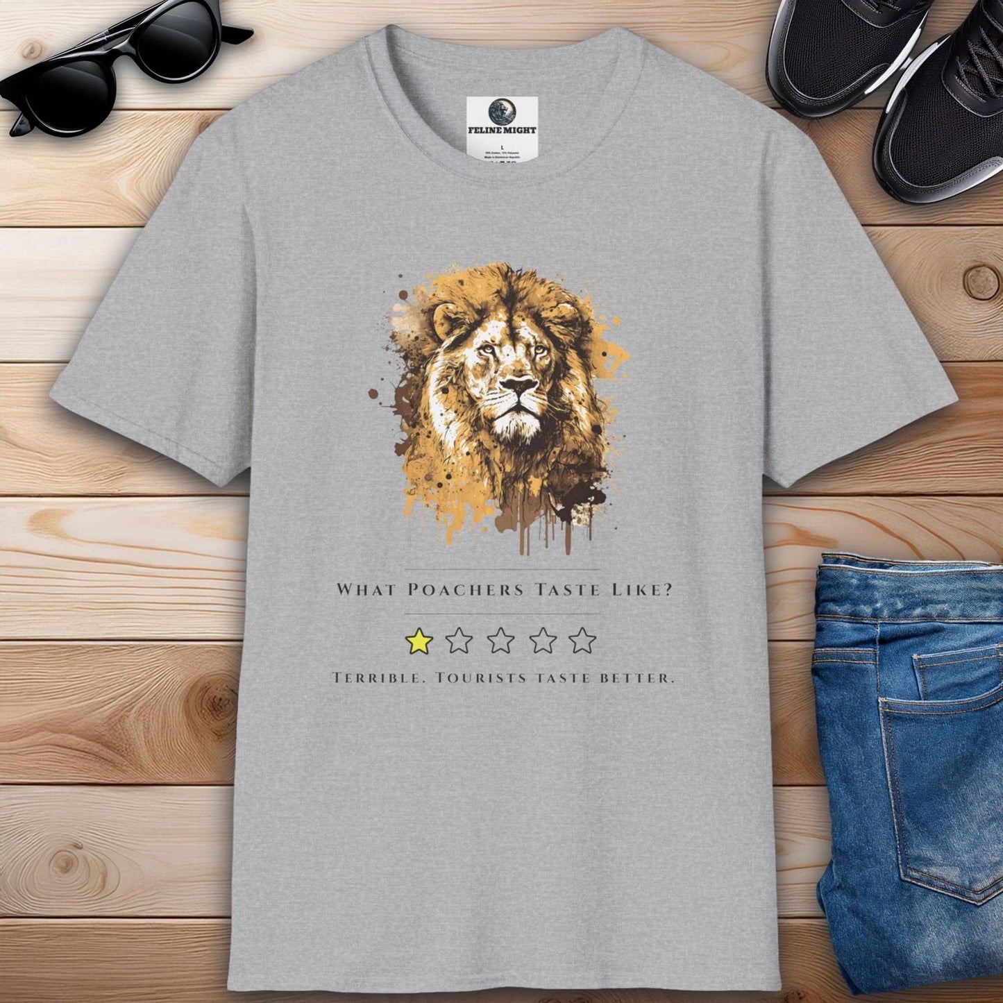 A stylish grey t-shirt with a lion illustration and the text 'What Poachers Taste Like?'