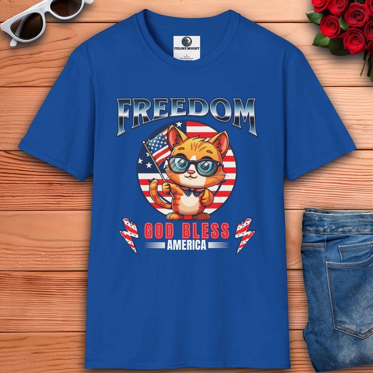 Cute cat wearing glasses on a royal blue t-shirt with 'Freedom God Bless America' design