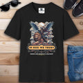 Black In God We Trust Lion T-Shirt featuring a lion and angelic warrior design with the text 'In God We Trust. Fangs Are Merely a Backup'.