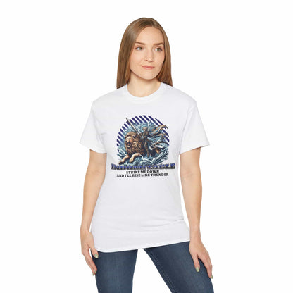 A woman wearing a white Indomitable Warrior Lion T-Shirt featuring a lion and warrior graphic with motivational quote.