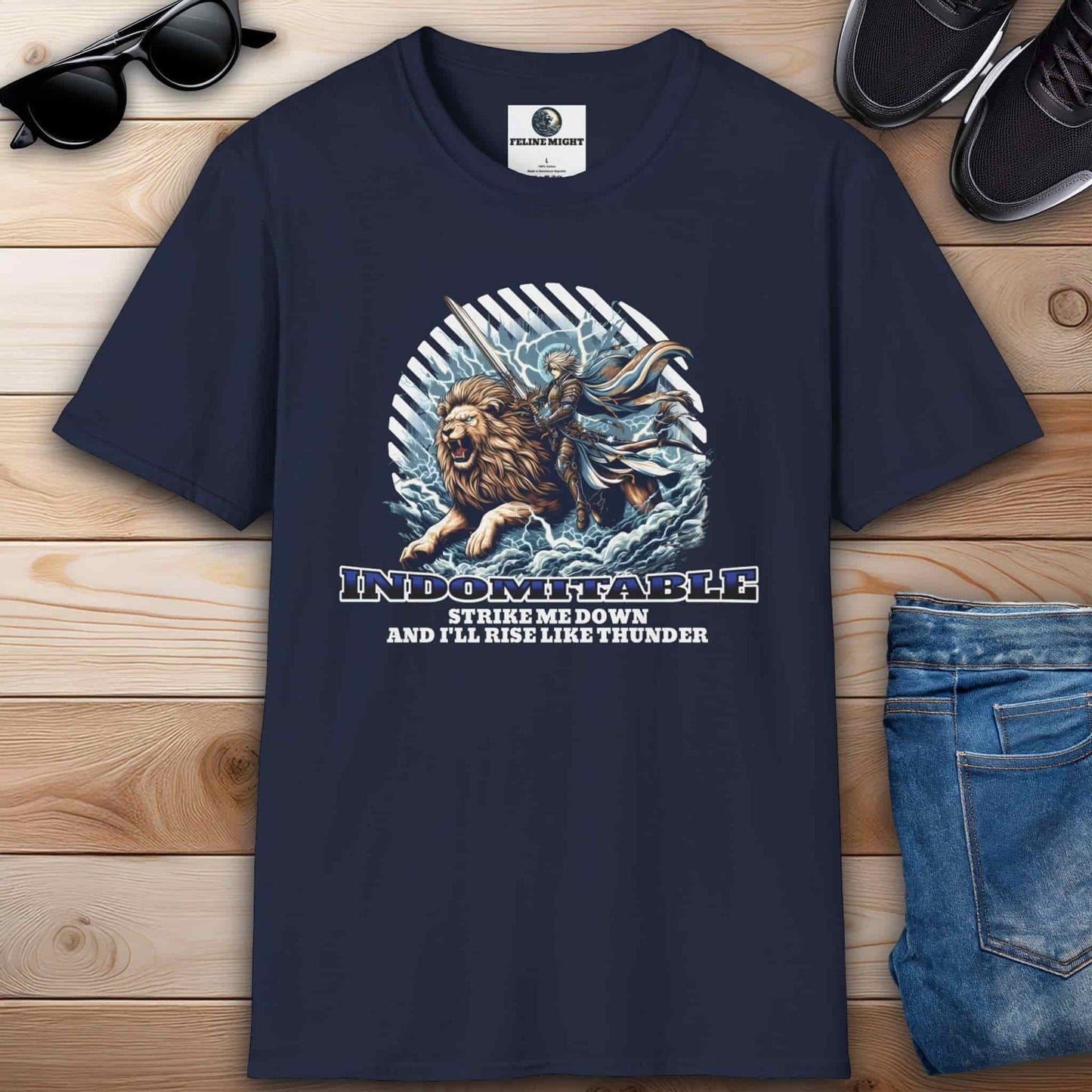 Navy blue t-shirt featuring a lion and a warrior with the text 'Indomitable: Strike me down and I'll rise like thunder.'