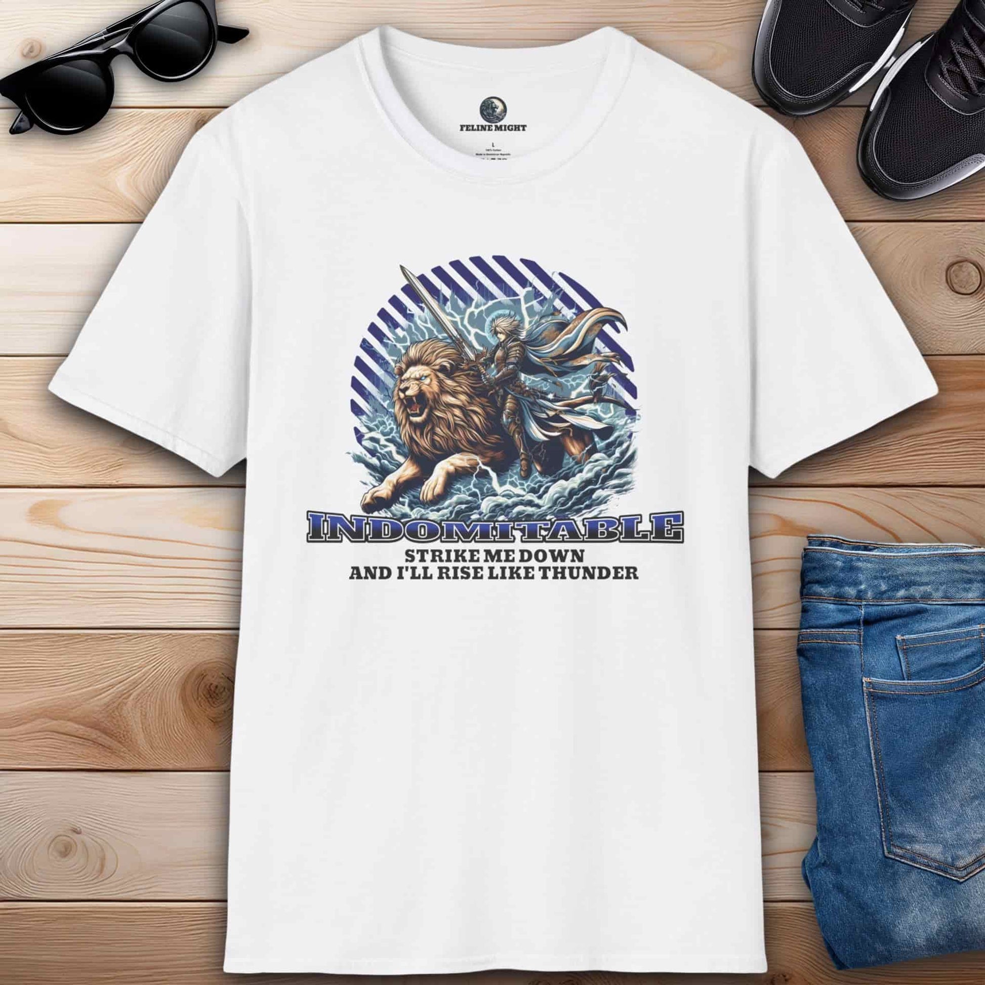 White t-shirt featuring a lion and a warrior with the text 'Indomitable: Strike me down and I'll rise like thunder.'