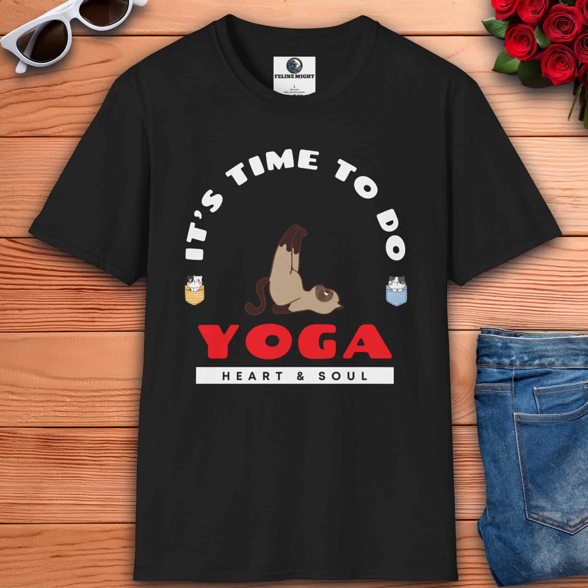 A black Cat Yoga Heart & Soul T-Shirt featuring playful cat graphics and yoga text on a white tee, perfect for yoga lovers.