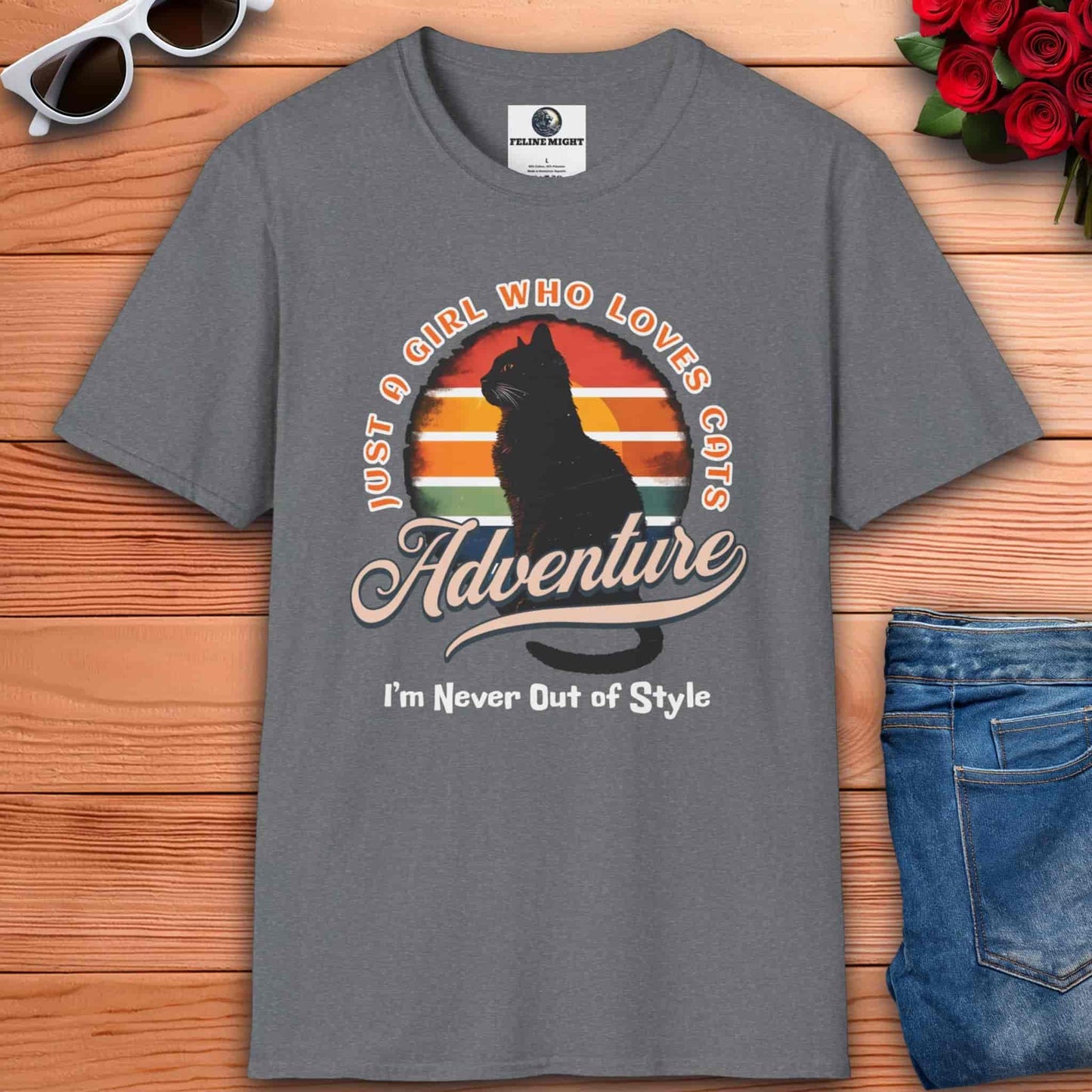 A gray Just a Girl Who Loves Cats T-Shirt featuring a cat silhouette, retro adventure design, and the text I'm Never Out of Style.