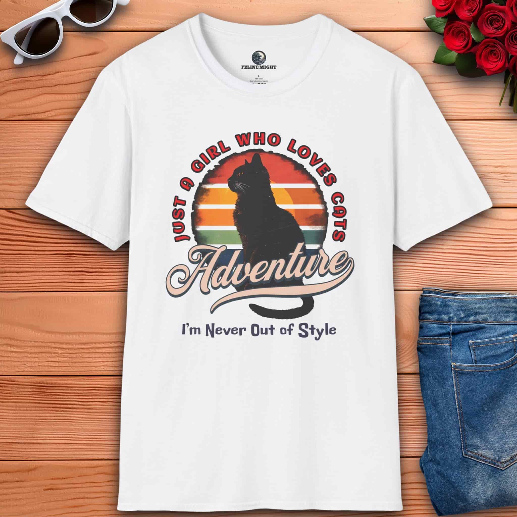 A white Just a Girl Who Loves Cats T-Shirt featuring a cat silhouette, retro adventure design, and the text "I'm Never Out of Style."